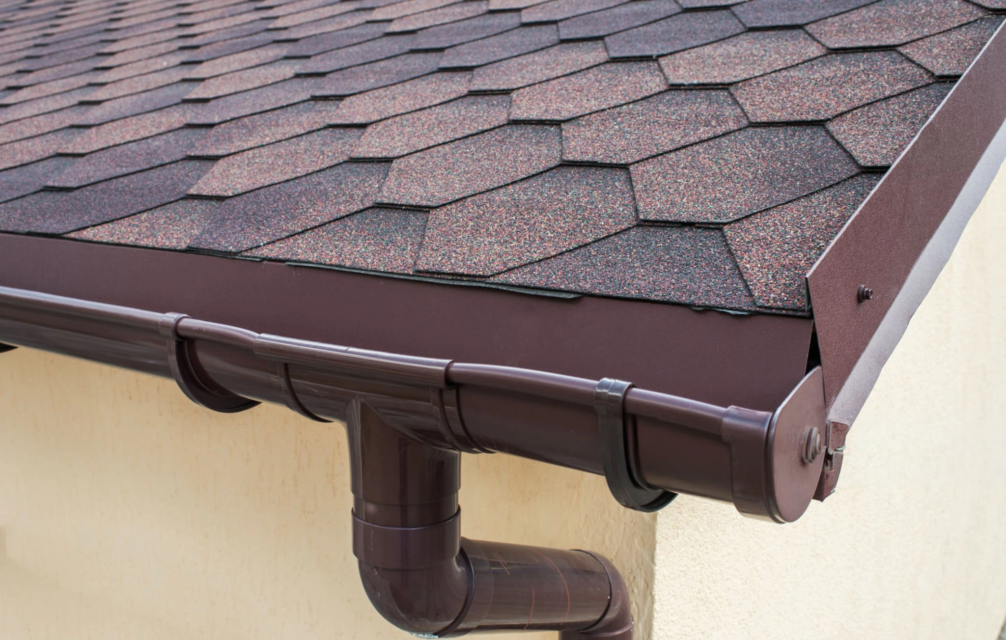 Gutter installation and roof drainage system improvements