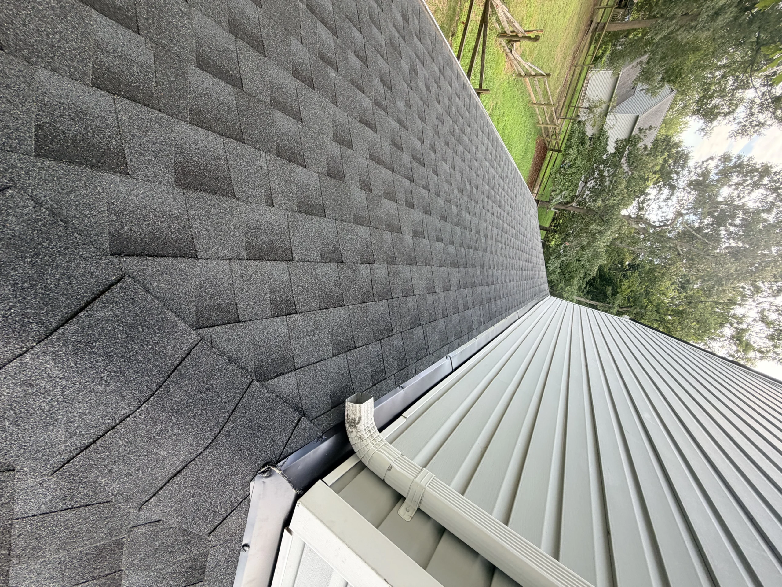 Roofing work near siding and exterior roofline details
