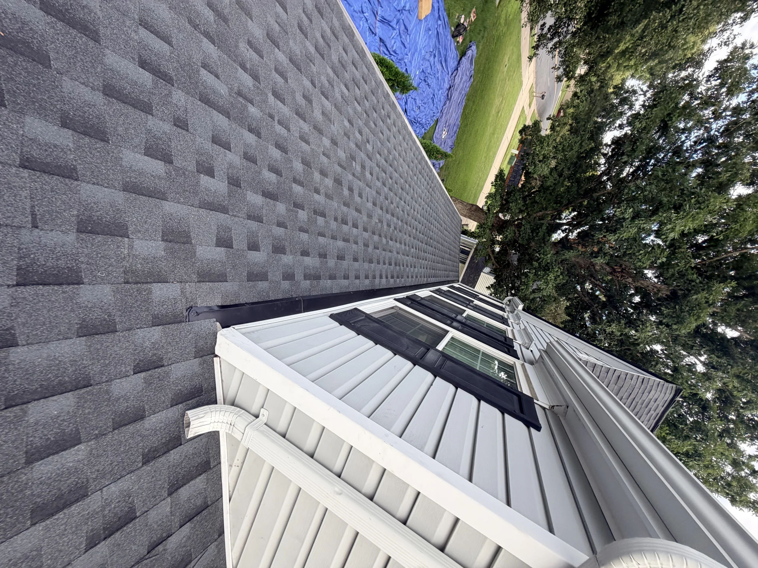 Professional residential roofing project with roof installation details